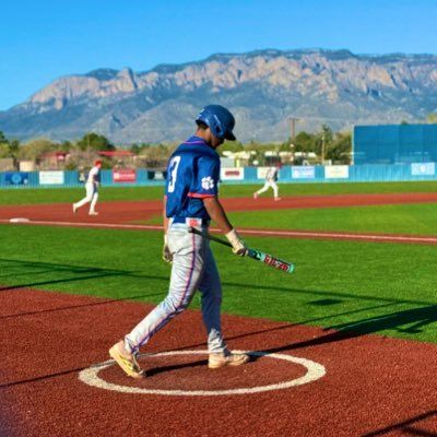 Eric Pedro Jr. wearing jersey 13 in the on-deck circle with a bat