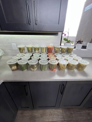 Rows of Burque Brine pickle containers ready on a kitchen counter