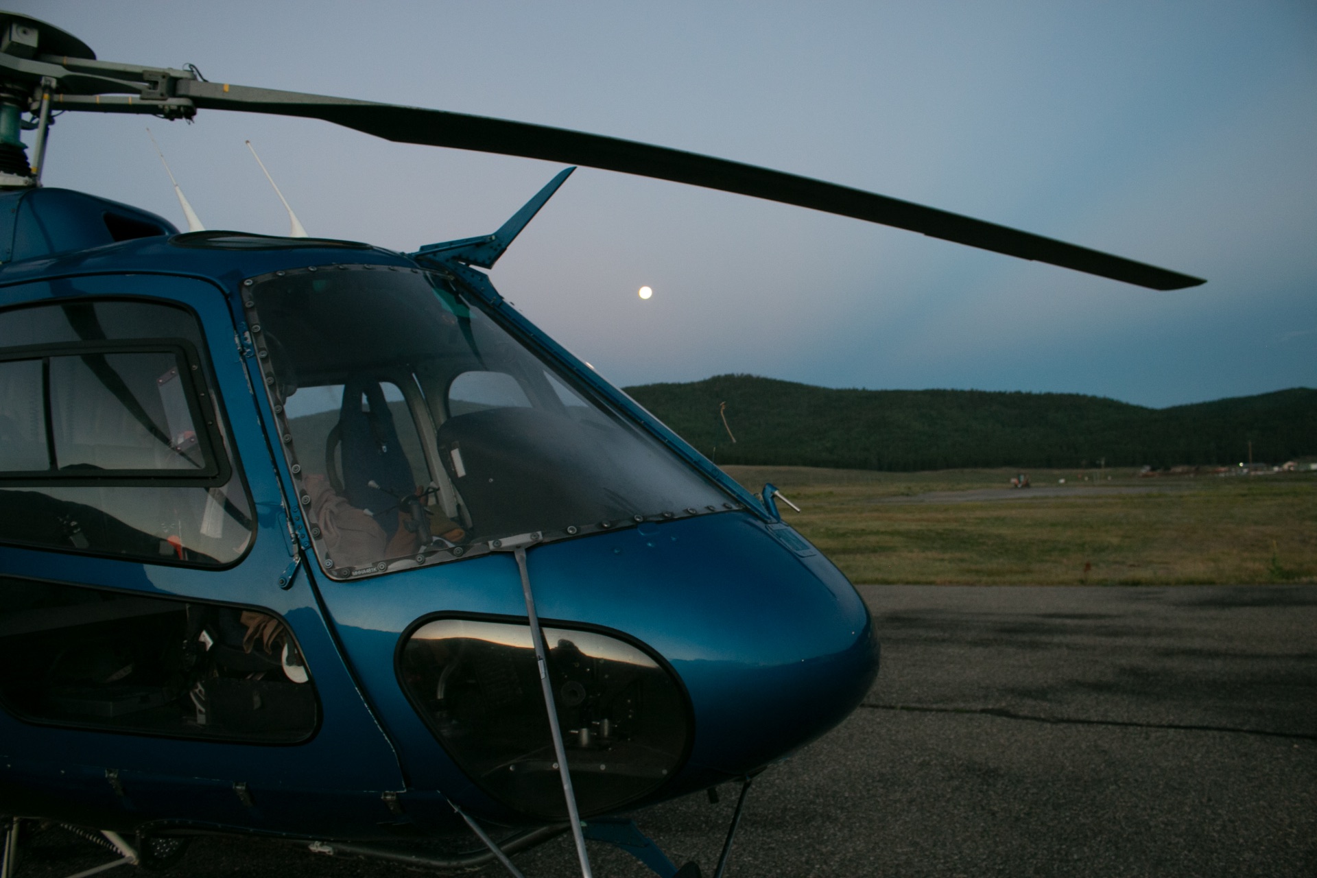 Blue AS350B3 at dusk